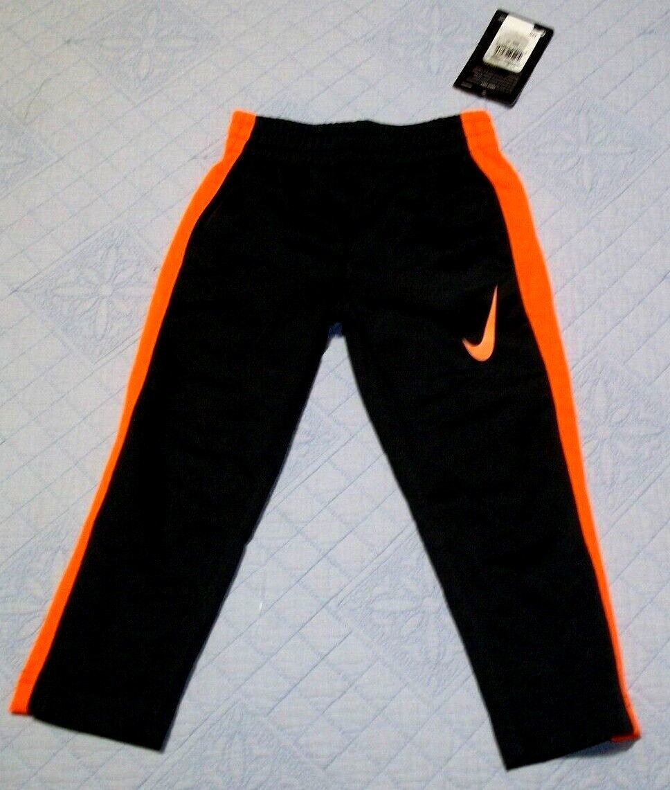 black and orange nike track pants