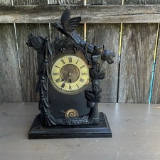 german black forest carved shelf clock running , for restoration.