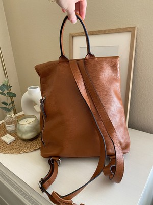 Vera Pelle Cognac Drawstring Bucket Bag Backpack Incredible sensoriality for unique bags. Backdropped by the  main image 3