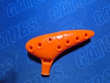 Orange Unique shape Whistle with holes in the side. Makes unique whistlin sounds
