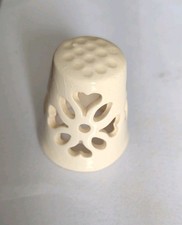 Timble - white lace-like openwork (filigree) design with heart-shaped cutouts