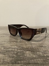 Miu Miu Women  s Cat Eye Sunglasses Brown Frame Brown Tinted Lens