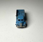 Blue vintage Tootsietoy #234 box truck with worn silver finish and “Made in U.S.A.” text on top side panel.