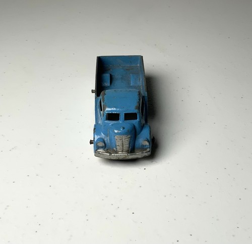Blue vintage Tootsietoy #234 box truck with worn silver finish and “Made in U.S.A.” text on top side panel.