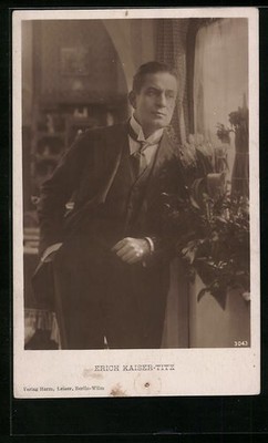 AK actor Erich Kaiser-Titz standing thoughtfully in a suit at the window
