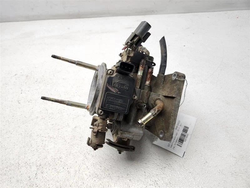 1991 1992 1993 Nissan Pickup corpo do acelerador 4 cilindros através de 3/92 fabricante de equipamento original 1611986G11 - Imagem 2 de 4