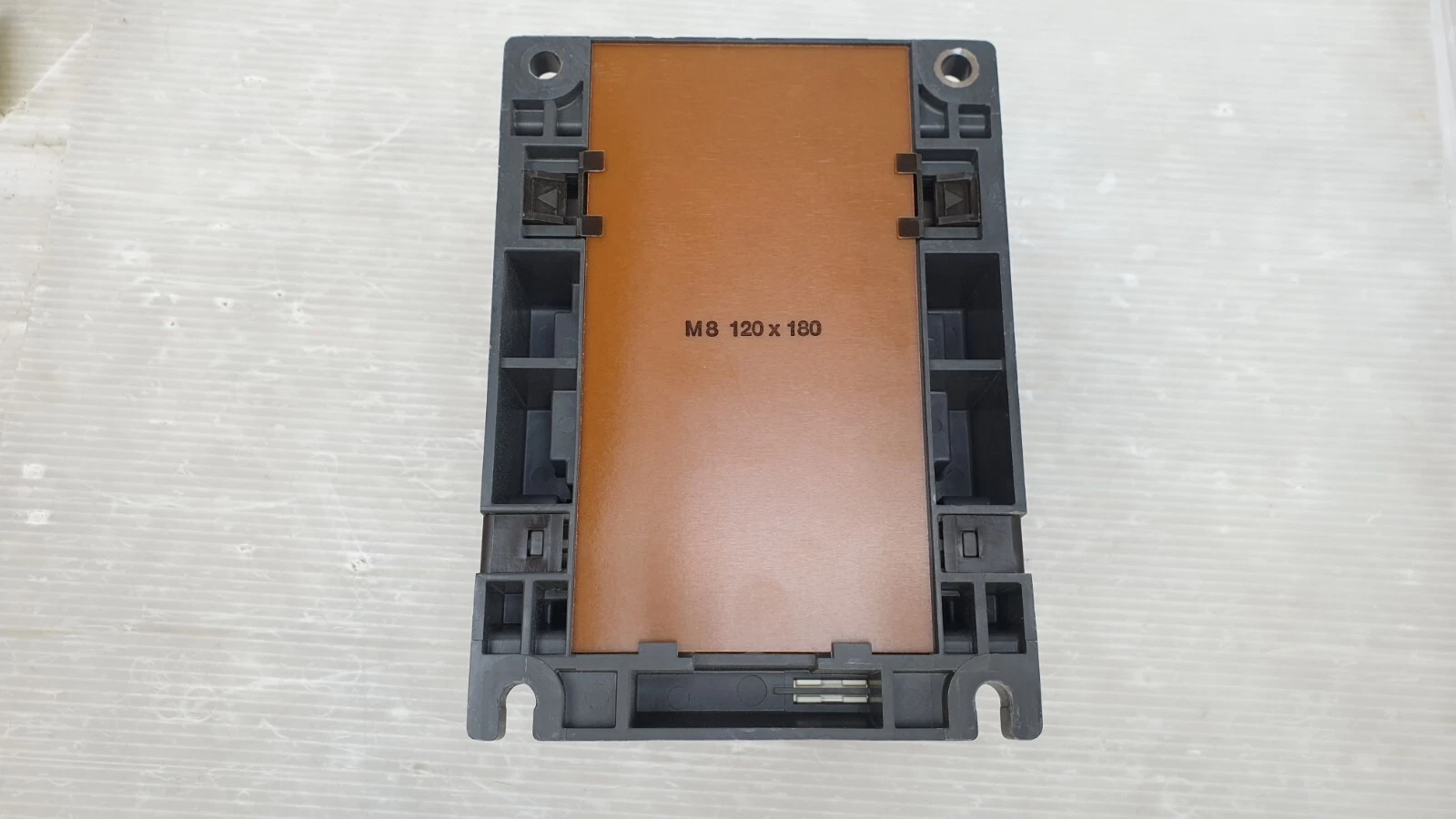 Base of the Siemens 3TF54 contactor marked M8 120 x 180