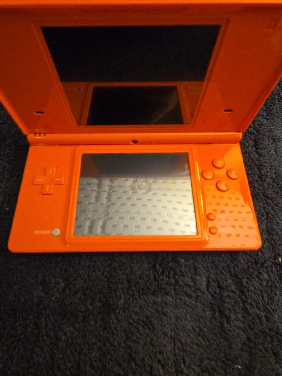 Nintendo DSi Orange handheld Console RARE, Great Condition, NO