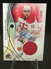 2024-25 UD SP GAME-USED #85 MIKAEL BACKLUND GAME-USED RED AUTO JERSEY /65 FLAMES