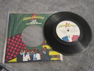 7'' single record ,L.T.D ,holding on , 1978