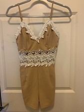 Tan Playsuit with White Lace Detail and Gold Accents. Comes with pockets 