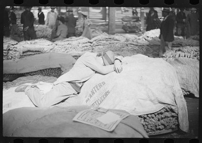 Durham North Carolina 1939 Tobacco Warehouse Farmer Sleeping on Tobacco Bale