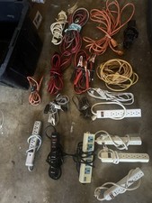 multiple power strips and various extension cords designed for organizing ele
