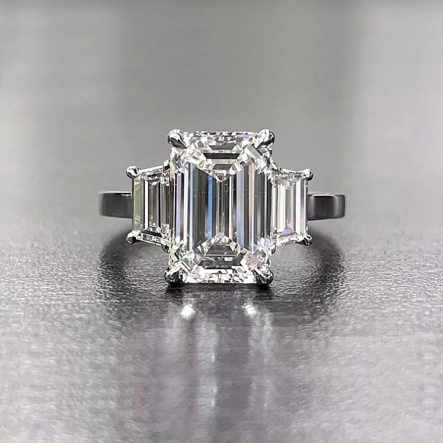 Platinum and rose gold emerald cut diamond ring