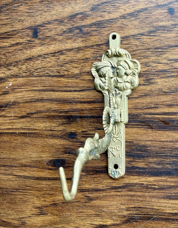 VINTAGE BRASS WALL HOOK FEATURING A MYTHICAL DRAGON OR SEA SERPENT