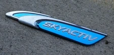 Mazda Skyactiv trunk emblem badge decal logo OEM Factory Genuine Original Stock