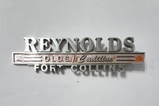 Vintage Reynolds Olds Cadillac Fort Collins Co Metal Dealer Badge Emblem Tag 