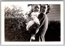 Vtg B&W Snapshot Smiling Mother Holding Baby Outside Hedgerow Sep 17 1939