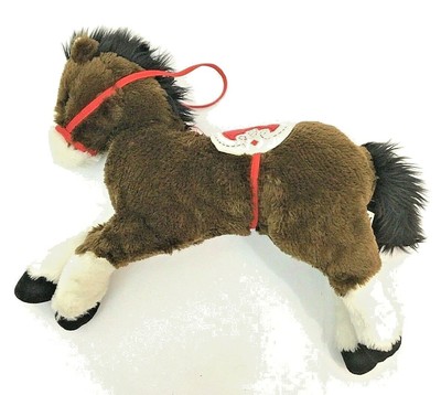 large stuffed horse with saddle