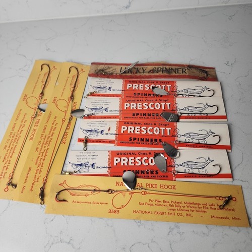 8 Old vintage fishing lures on original tackle dealers cards.