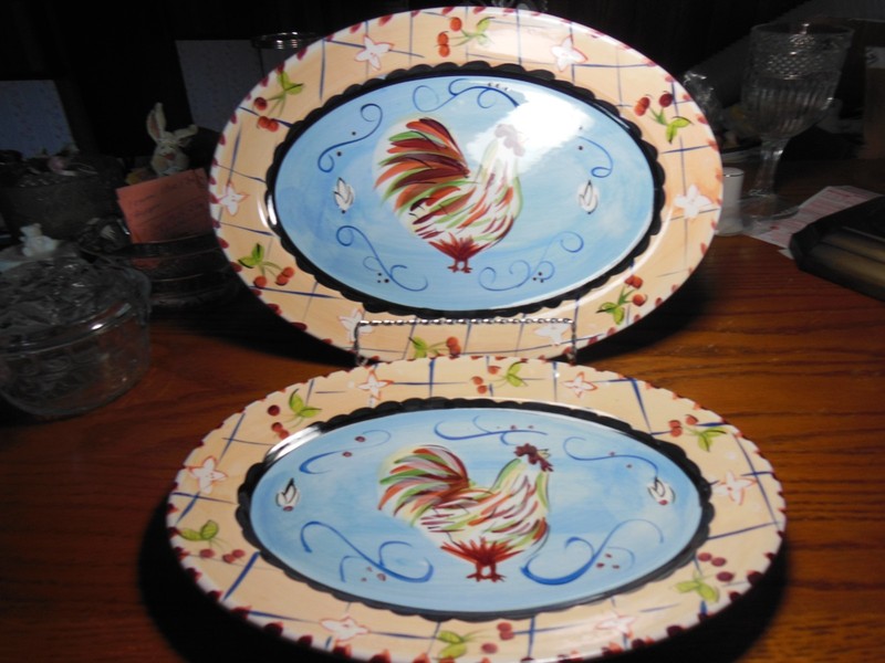 2 Hand-painted ceramic serving platters featuring a rooster motif by Hausenware.