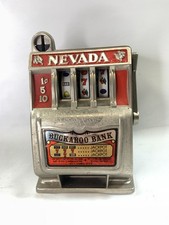 Vintage Nevada Buckaroo Bank Slot Machine Coin Bank One Arm Bandit Toy