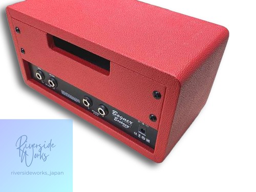 Red BOGNER Exstacy Mini amplifier with black/silver control panel, input jacks, and visible “BOGNER” and “Exstacy” branding.