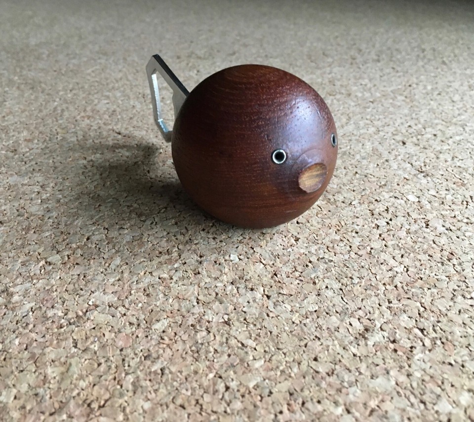 A teak wood fish-shaped bottle opener by HAJ — wildly specific, totally charming, and exactly the kind of MCM barware object that stops people in their tracks.