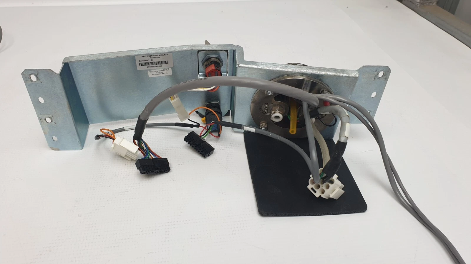 Rear of the SA-0021971 front I/O panel bracket with wiring harness and labels