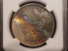 1885-O Morgan Dollar (NGC MS-64) rainbow toned