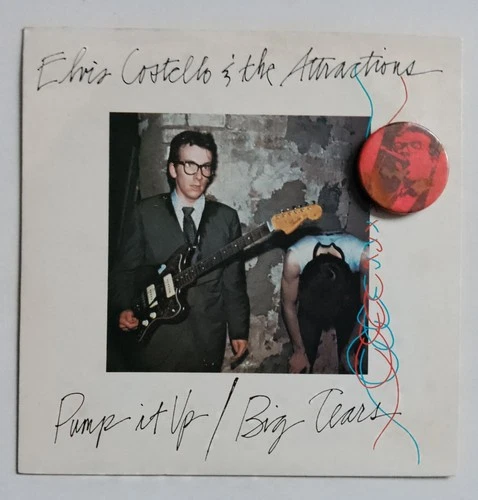 ELVIS COSTELLO & THE ATTRACTIONS - PUMP IT UP RARE 7"  Plus Vintage badge 1978