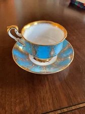 Paragon Teacup & Saucer light Blue and Gold accents with Pink Roses 