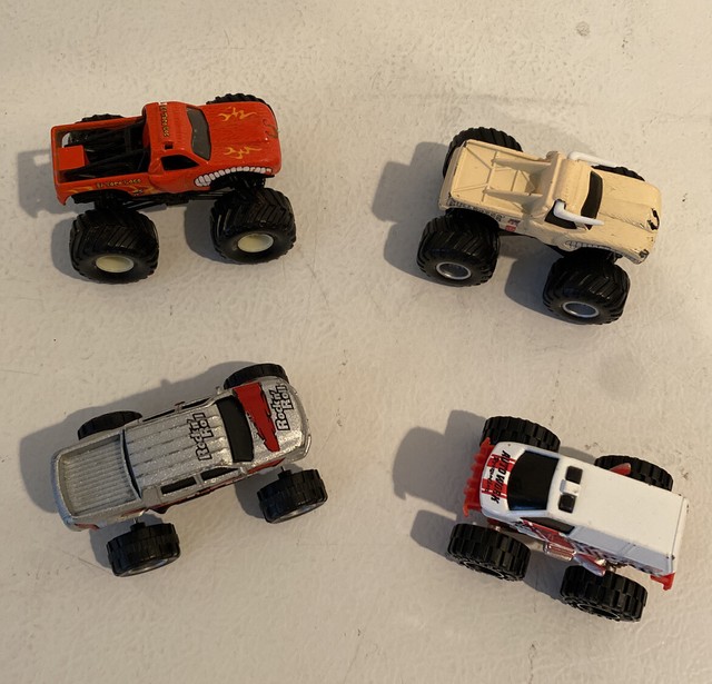 4 Diecast Plastic Monster Trucks Bulldozer, El Toro Loco, RockNRoll