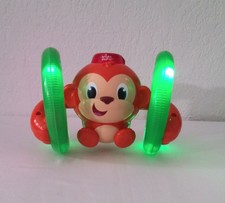Bright Starts Roll Glow Monkey Toy with Lights and Melodies, Ages 6 months