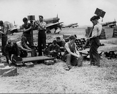 Servicing Commandos of the RAF have a busy time on the Normandy ai- Old Photo