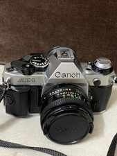 Canon AE-1 Program 35mm SLR Film Manual Camera with 50mm f/1.8 Lens