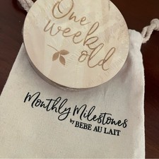      Baby Milestones Wooden Disc Set by Bebe au Lait in Cloth Bag, for pictures.