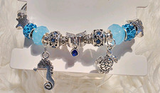 Handmade Silver Tone Blue Beaded Charm Bracel...