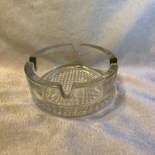 Vintage 4"  round ashtray MCM 4 cigarette slots clear textured bottom heavy glas