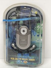 New Silver Coby CX-7 Mini AM FM Pocket Radio DBBS Portable Earphones Neck Strap