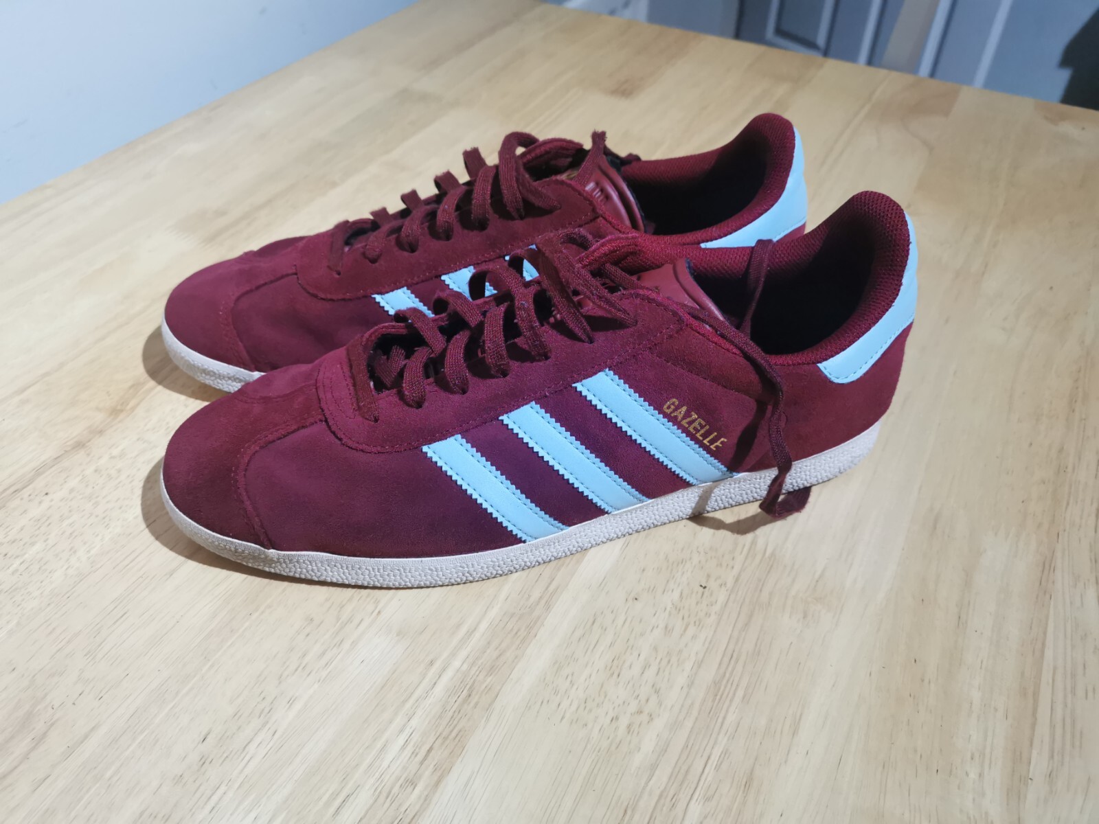 claret and blue adidas trainers