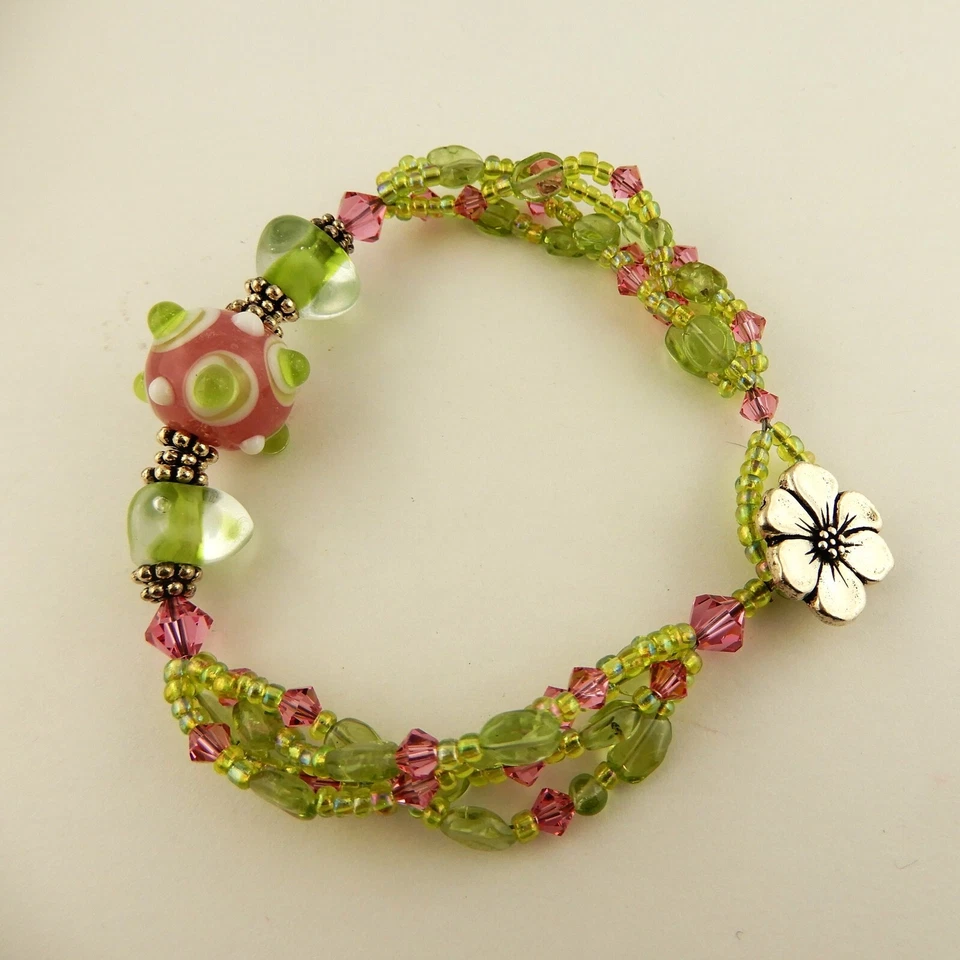 3 strand bracelet made w/ Swarovski, Peridot pink & green beads & flower clasp - Image 2 of 4