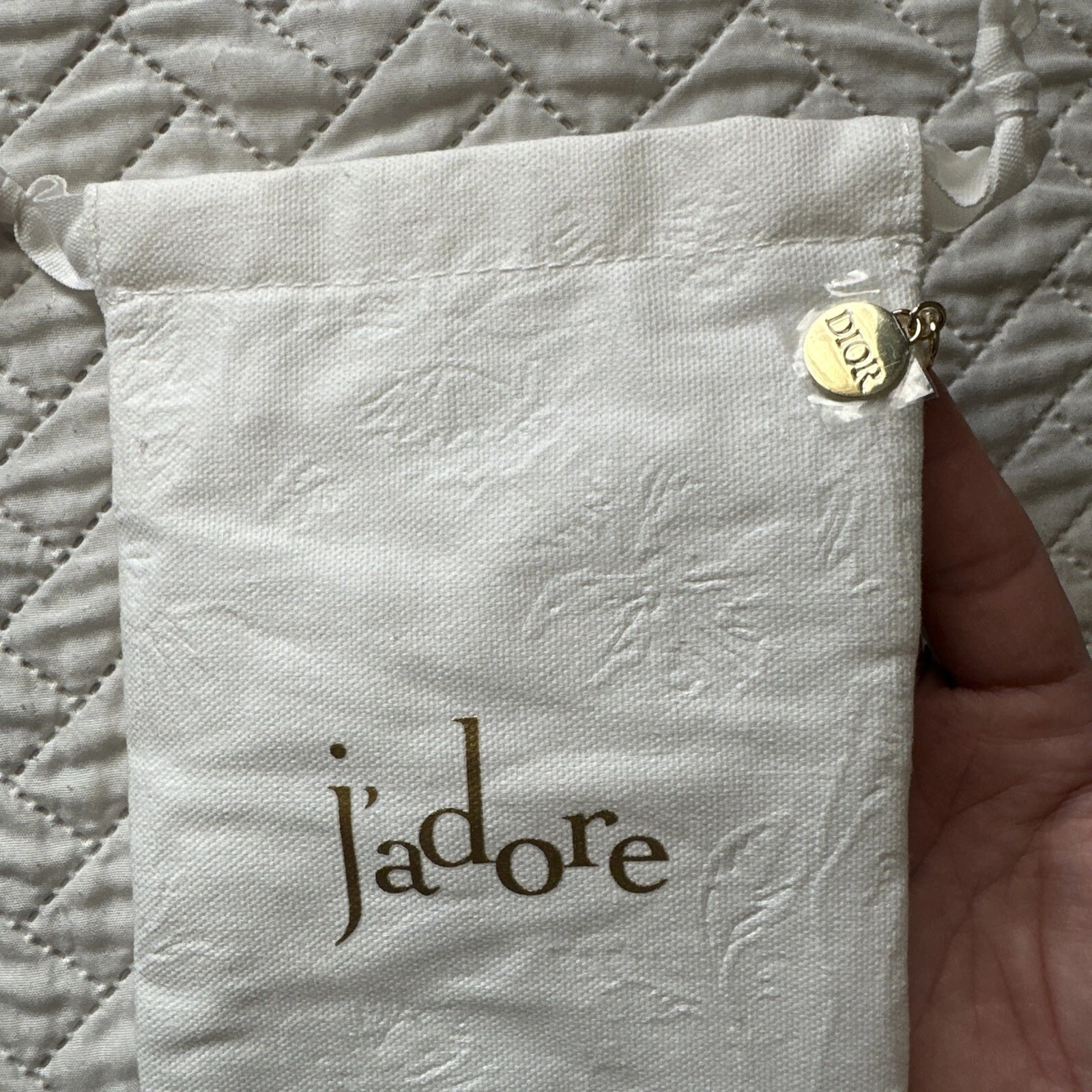 Sac cadeau pochette cordon blanc logo doré Dior Jadore