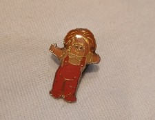 vintage Cabbage Patch Kids enamel lapel pin featuring a doll in red overalls