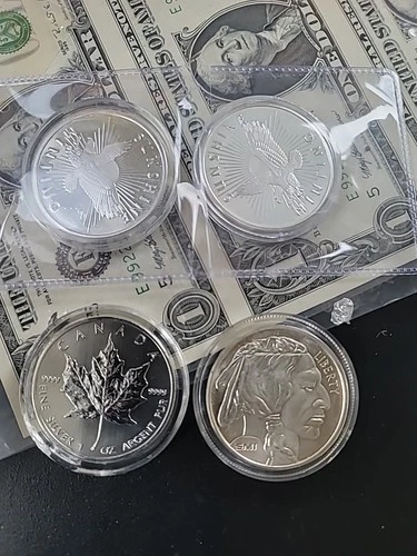 Lot Of Four 1 Oz Silver Rounds. 2 Sunshine Mint 1 Mapleleaf And 1 Buffalo