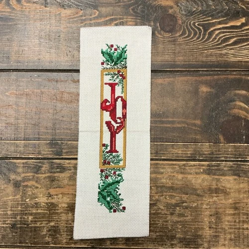 Completed Counted Cross Stitch “Joy” With Holly Leaves Fabric 4”x 11.5”