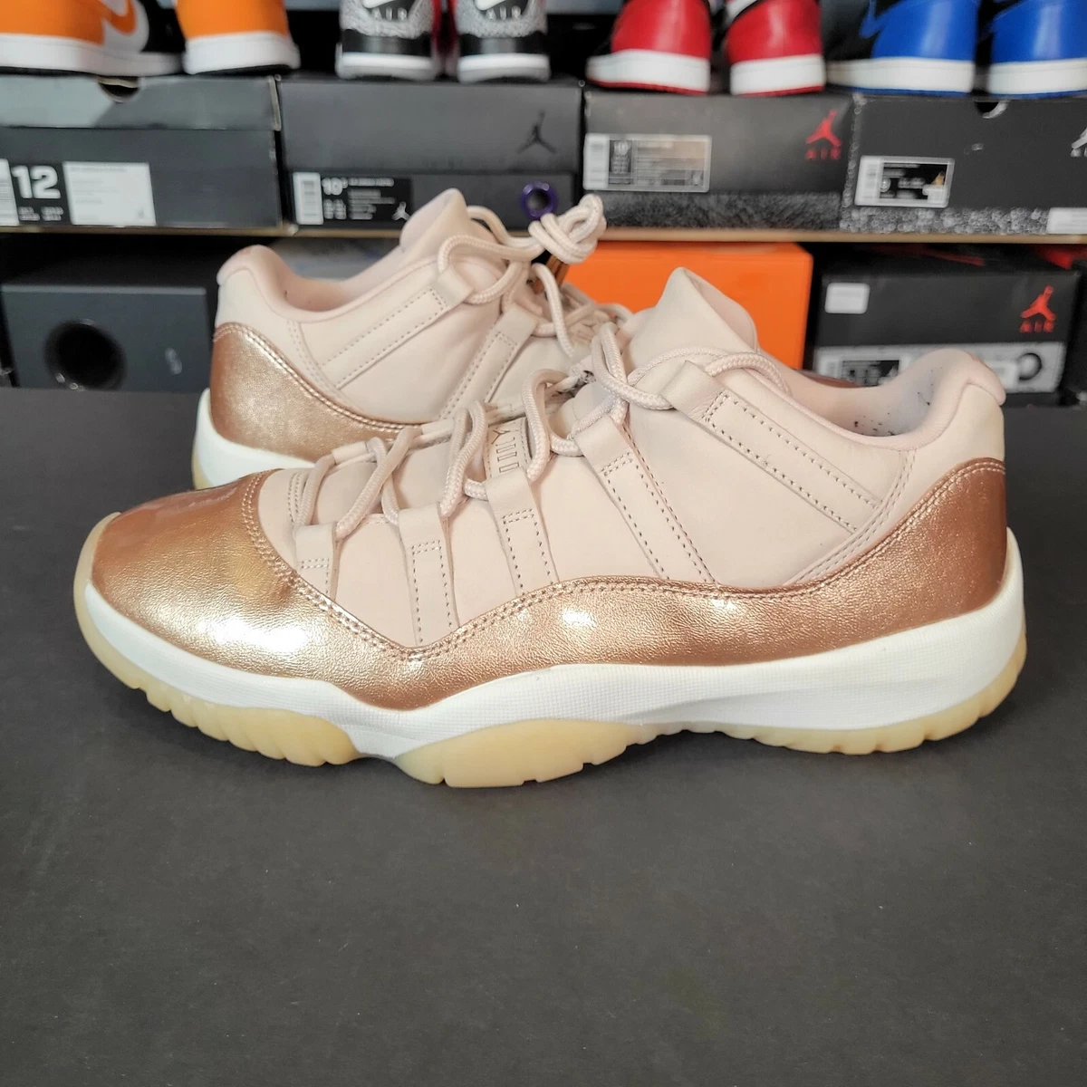 Jordan 11 low womens rose best sale gold