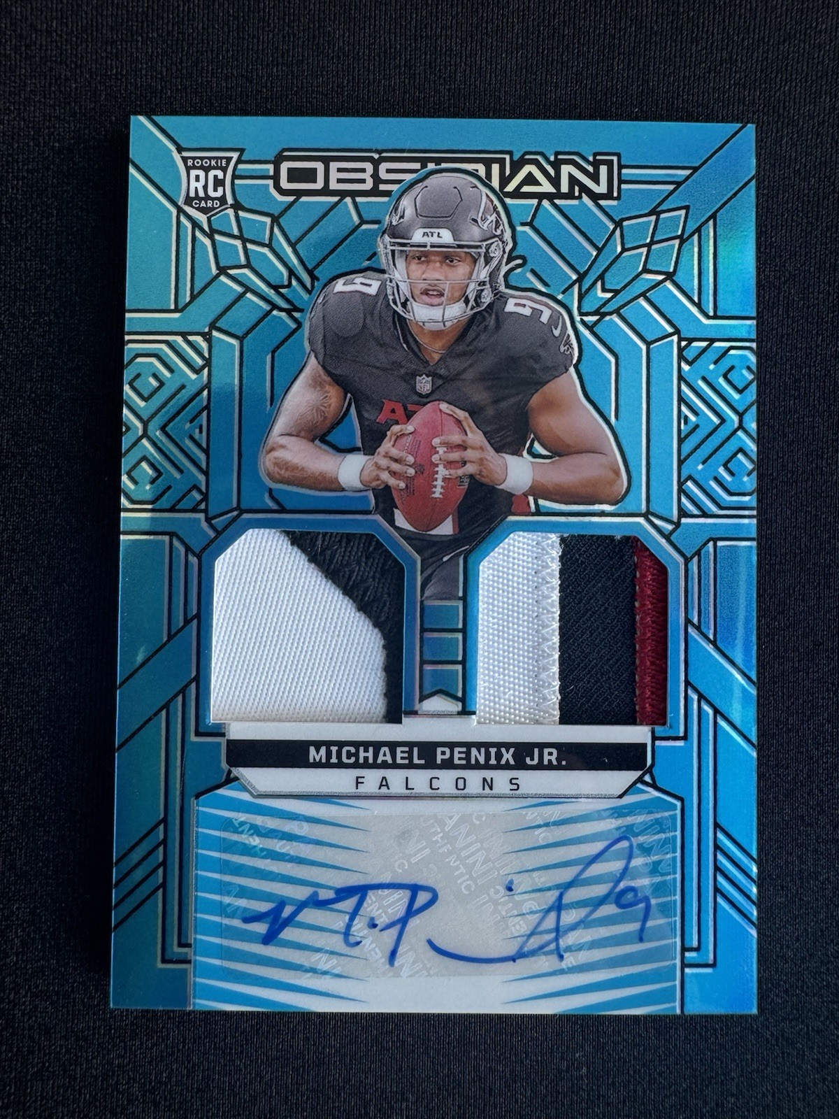Michael Penix Panini Obsidian Rookie Materials Ink #RMIMPJ Blue