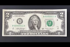 ERROR $2 DLL BILL - MISCUT MARGINS UNEVEN & PRINT SHIFT, SERIAL CLOSER TO TOP.