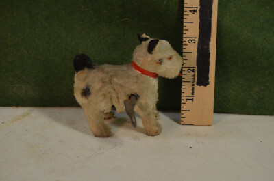 Small wind-up dog, late 40's, hops around in a circle, when wound, ex cond